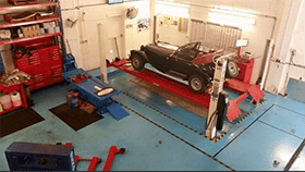 car on ramp in garage